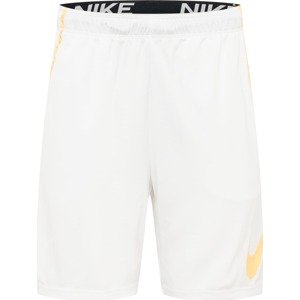 Sportovní kalhoty Nike meruňková / bílá