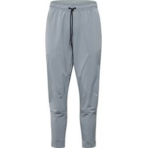 Sportovní kalhoty 'UNLIMITED' Nike šedá / černá